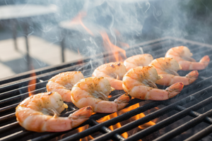 grilling large white pacific shrimp on grill
